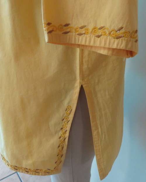 As new buttercup yellow richly embroidered top.Bracelet length sleeves.By BABA forn Kashmi.Size 40