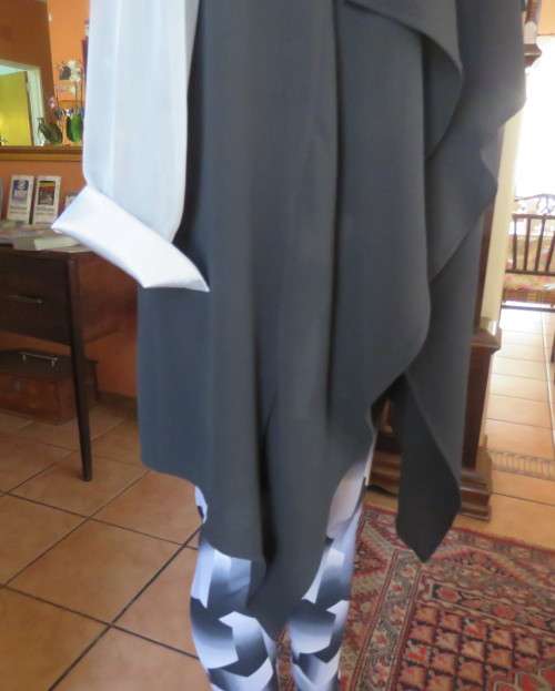 Magnificent black waterfall style sleeveless gilet 40/16.Absolute as new,Stretch poly.Calf length