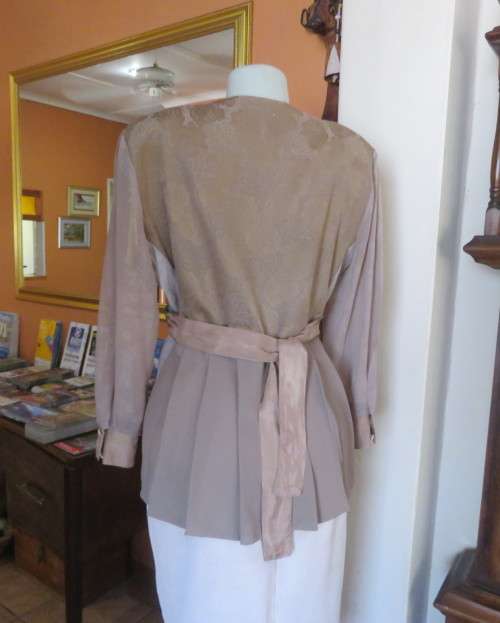Stunning long sleeve peplum jacket in 6 fabric designs.Collarless.4 dummy pockets.By GARBO FLAIR 42