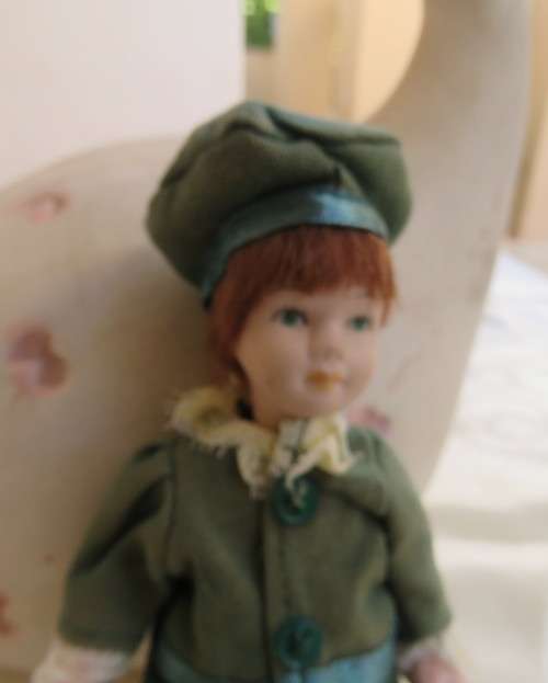 Antique doll 16cm tall with clothing. See all scans. Very good condition