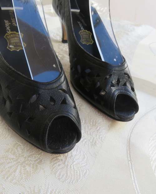 High quality black genuine leather shoes by FEMME Shoes size 6.5.Open toe. Cut-out leather.As new.