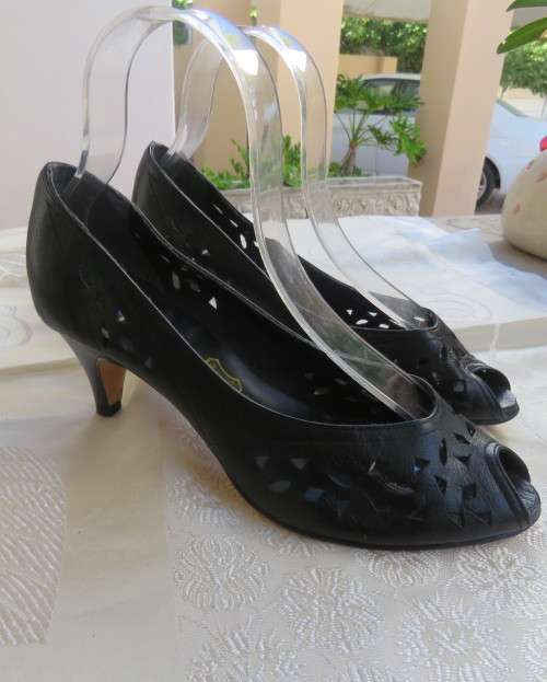 High quality black genuine leather shoes by FEMME Shoes size 6.5.Open toe. Cut-out leather.As new.