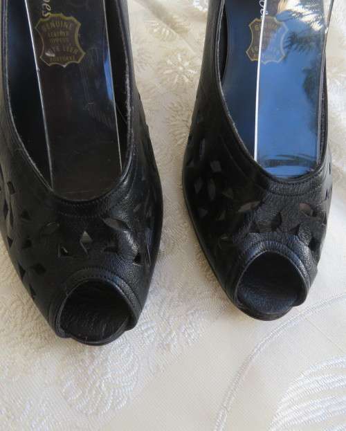 High quality black genuine leather shoes by FEMME Shoes size 6.5.Open toe. Cut-out leather.As new.