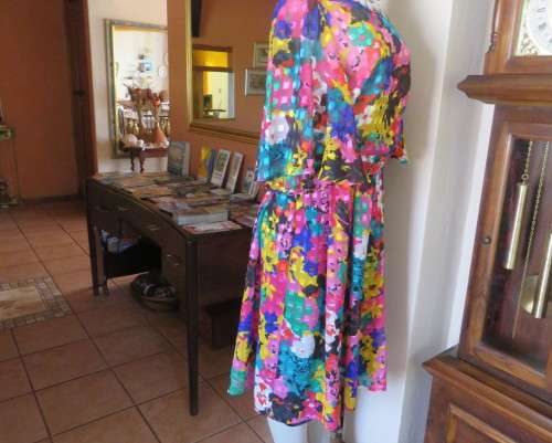 Eye catching vintage sheer polyester dress size 38/14.Bell sleeves.Pleated skirt.Opening at back.