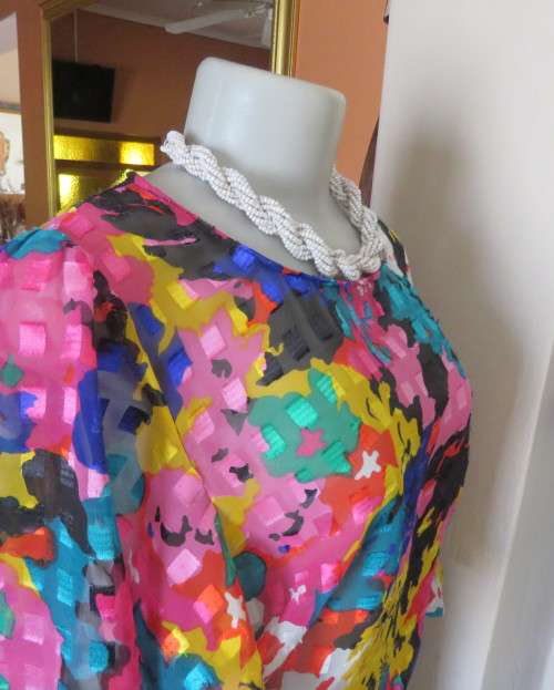 Eye catching vintage sheer polyester dress size 38/14.Bell sleeves.Pleated skirt.Opening at back.