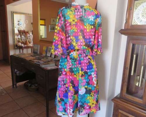 Eye catching vintage sheer polyester dress size 38/14.Bell sleeves.Pleated skirt.Opening at back.