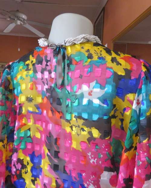 Eye catching vintage sheer polyester dress size 38/14.Bell sleeves.Pleated skirt.Opening at back.