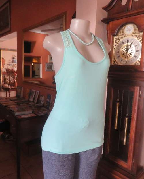 Sweet seafoam green stretch viscose with lace yoke shoulders and back .U front neckline .Size 36.