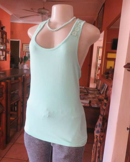 Sweet seafoam green stretch viscose with lace yoke shoulders and back .U front neckline .Size 36.
