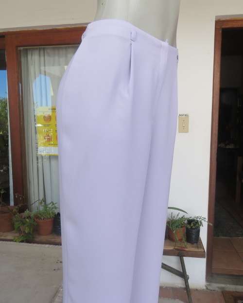 Ankle length lavender textured polyester pants with front pleats. Size 38/14 by FOSHINI. As new.
