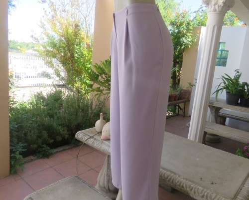 Ankle length lavender textured polyester pants with front pleats. Size 38/14 by FOSHINI. As new.