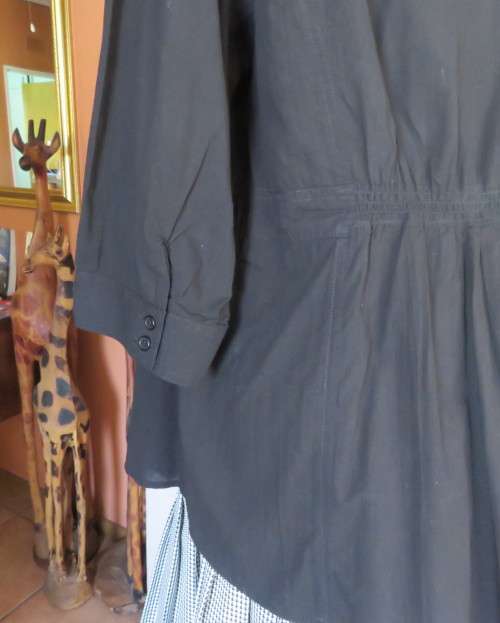 Pretty black cotton button down top with beautiful tucking on front.Band in waist.Size 46.New cond.