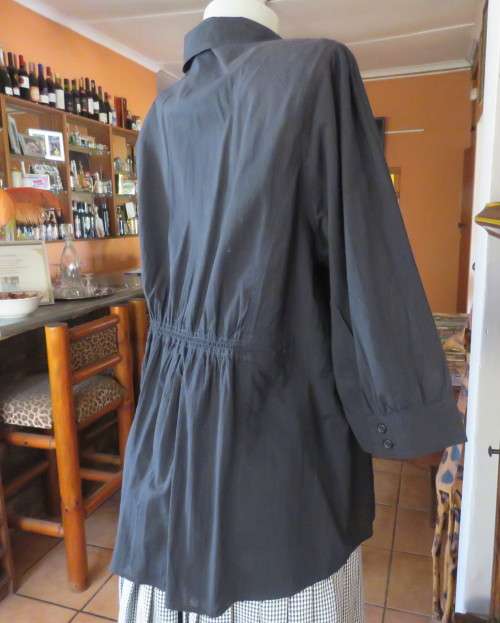 Pretty black cotton button down top with beautiful tucking on front.Band in waist.Size 46.New cond.