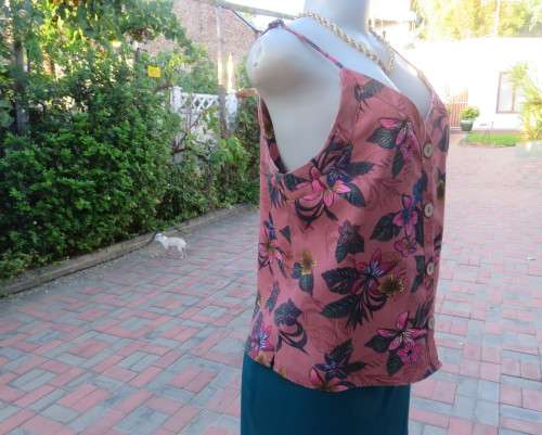 Sexy brick colour strappy top with floral patterns.Button down.Size 34 by RED.Never used.