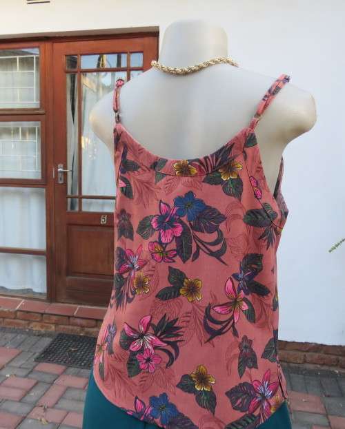 Sexy brick colour strappy top with floral patterns.Button down.Size 34 by RED.Never used.