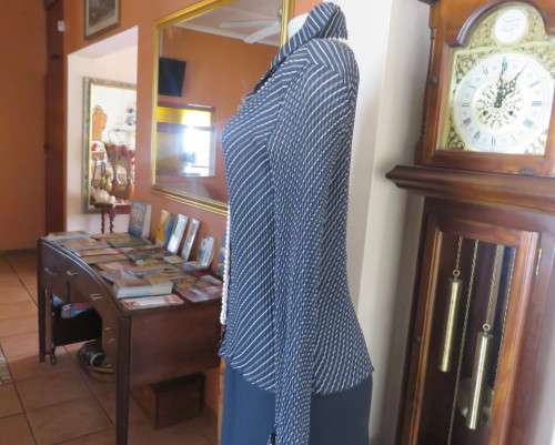 Stunning black/white permanent pleated diagonal striped top.Size 34/36 by OASIS. New condition.