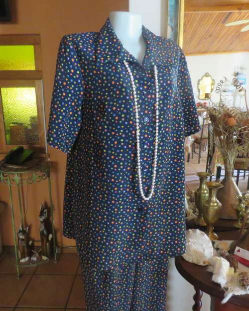 Beautiful Boutique made 2 pc polyester w/w pant suit.Navy with colourful dots.Size 40 to 42.As new
