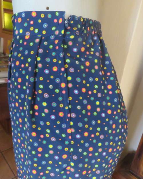 Beautiful Boutique made 2 pc polyester w/w pant suit.Navy with colourful dots.Size 40 to 42.As new