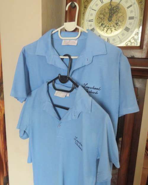Blue short sleeve WESBANK LAERSKOOL sport shirts size 30 and 32. As new conditon.Buy 1 or both.