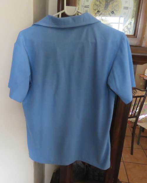 Blue short sleeve WESBANK LAERSKOOL sport shirts size 30 and 32. As new conditon.Buy 1 or both.