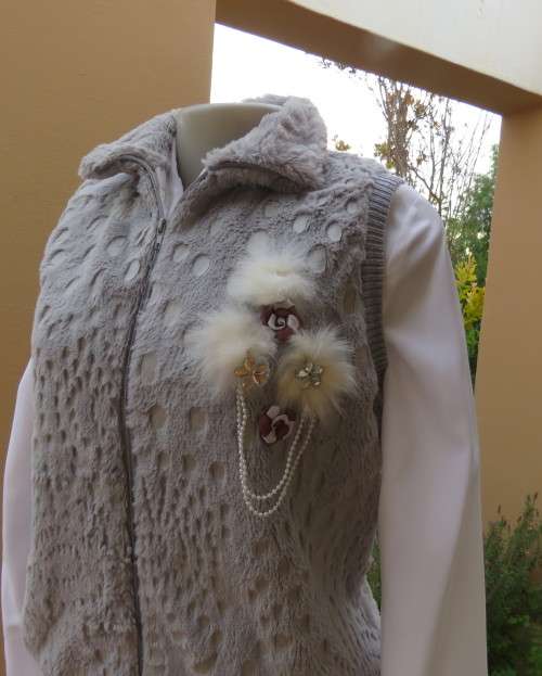 Warm,cozy silver grey fluffy polyester zip-up lined waistcoat.High neckline.Size 36 to 38.As new