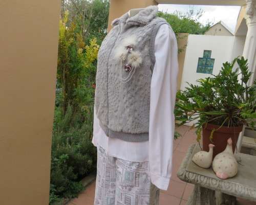 Warm,cozy silver grey fluffy polyester zip-up lined waistcoat.High neckline.Size 36 to 38.As new