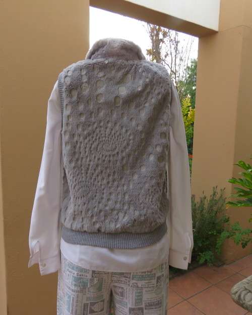 Warm,cozy silver grey fluffy polyester zip-up lined waistcoat.High neckline.Size 36 to 38.As new