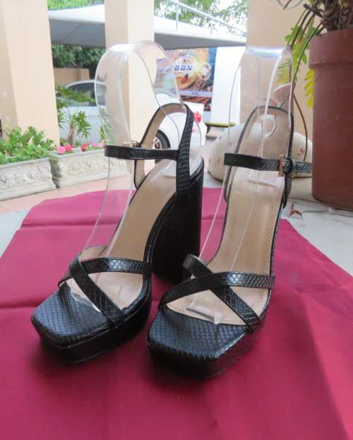 Pair of black block heel faux snake skin shoes. Ankle straps and straps over feet.Size 3.5.As new