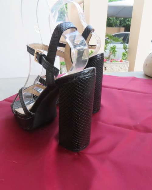 Pair of black block heel faux snake skin shoes. Ankle straps and straps over feet.Size 3.5.As new