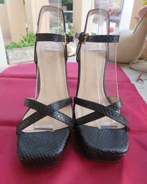 Pair of black block heel faux snake skin shoes. Ankle straps and straps over feet.Size 3.5.As new