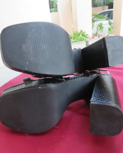 Pair of black block heel faux snake skin shoes. Ankle straps and straps over feet.Size 3.5.As new