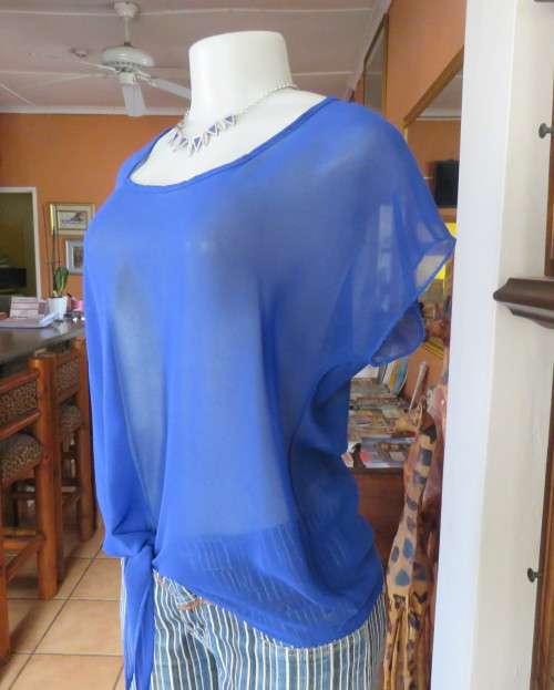 Chic little royal blue sheer polyester slip over top with cut-on sleeves.Size 36/38.By KINGS BABY.