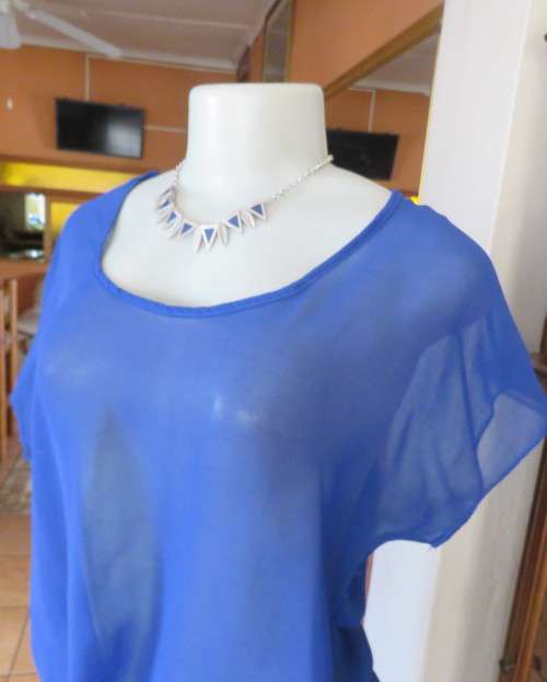 Chic little royal blue sheer polyester slip over top with cut-on sleeves.Size 36/38.By KINGS BABY.