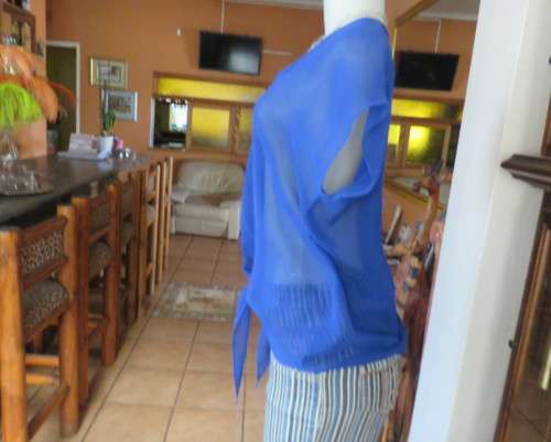 Chic little royal blue sheer polyester slip over top with cut-on sleeves.Size 36/38.By KINGS BABY.