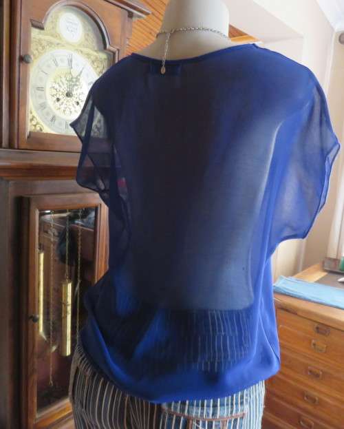 Chic little royal blue sheer polyester slip over top with cut-on sleeves.Size 36/38.By KINGS BABY.