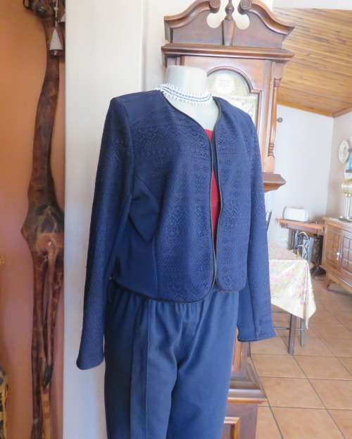 Beautiful navy cropped jacket size 40/16 by OR.Stretch polyester fabric and lace.Collarless.As new