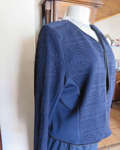 Beautiful navy cropped jacket size 40/16 by OR.Stretch polyester fabric and lace.Collarless.As new