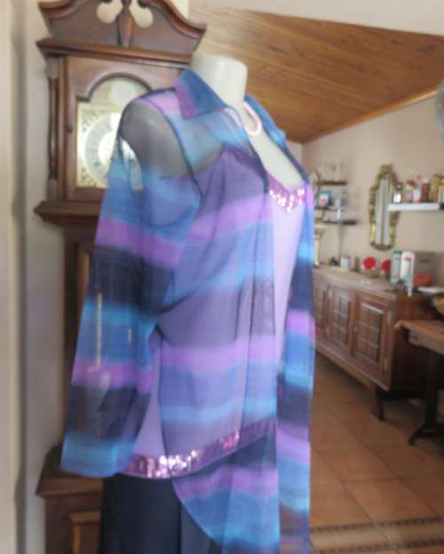 Striking sheer polyester open long sleeve top in blues and purples. Long fronts to tie.Size 38 to 40
