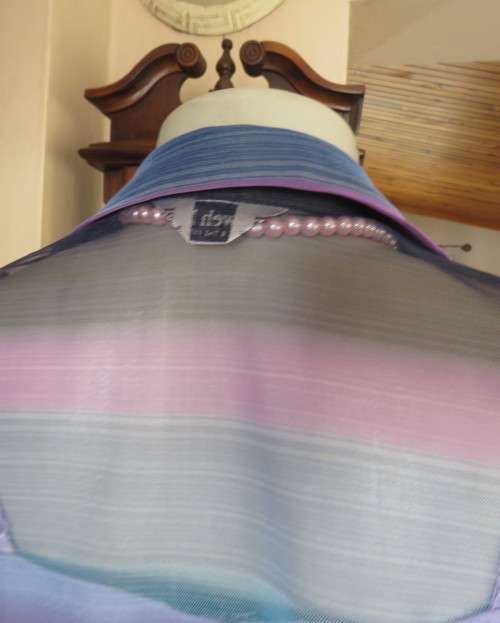 Striking sheer polyester open long sleeve top in blues and purples. Long fronts to tie.Size 38 to 40