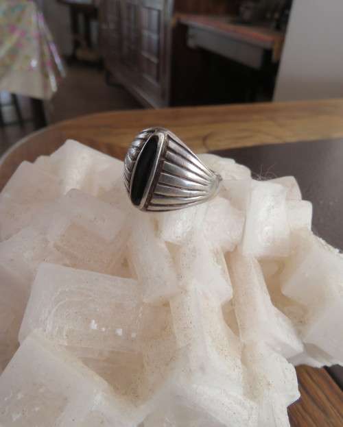 Handsome men`s 925 silver size 9.5 uniquely styled ring. With narrow black stone. New condition.