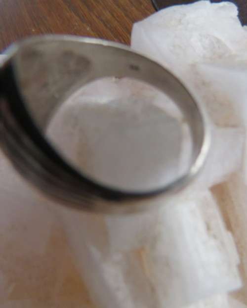 Handsome men`s 925 silver size 9.5 uniquely styled ring. With narrow black stone. New condition.