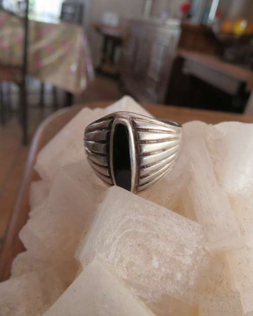 Handsome men`s 925 silver size 9.5 uniquely styled ring. With narrow black stone. New condition.