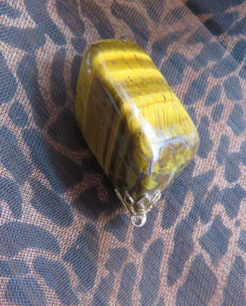 Large genuine tigereye pendant size 4.5cm x 2.5cm. New condition.