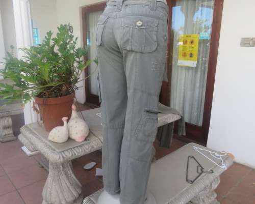 Vintage authentic 100% cotton. Wash out distressed look.Sage green.Pockets and stitching galore. 34.