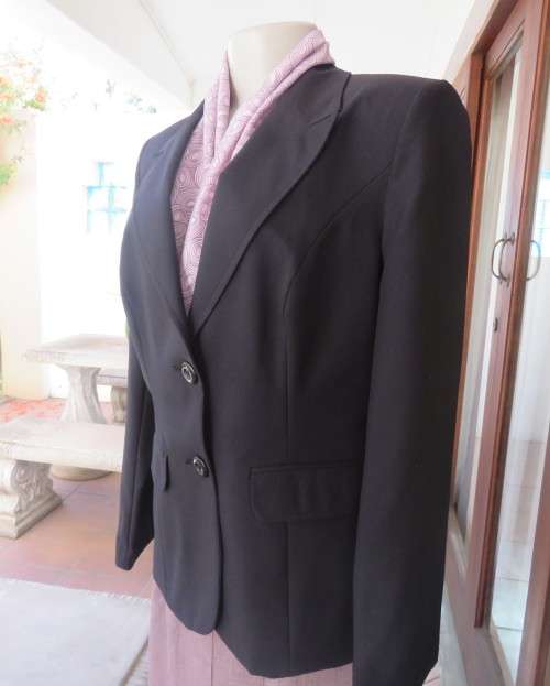 Brand new elegant very black long sleeve jacket by WOOLWORTHS size 36/12.Front pockets.Never used.