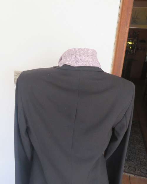 Brand new elegant very black long sleeve jacket by WOOLWORTHS size 36/12.Front pockets.Never used.