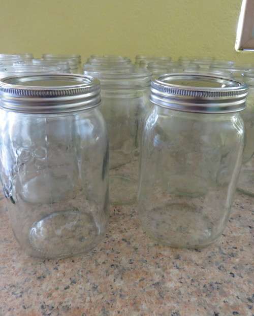 23 x Consul 1Litre preserve jars with new metal domes and lids. From late 80`s New condition.