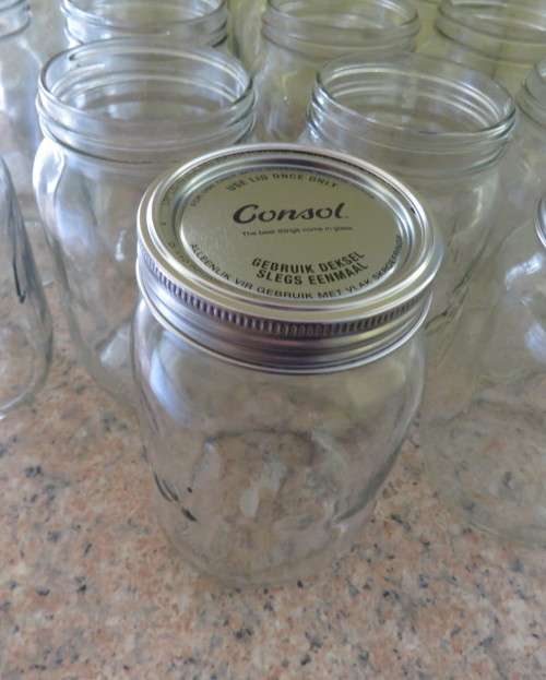 23 x Consul 1Litre preserve jars with new metal domes and lids. From late 80`s New condition.