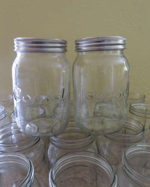 23 x Consul 1Litre preserve jars with new metal domes and lids. From late 80`s New condition.
