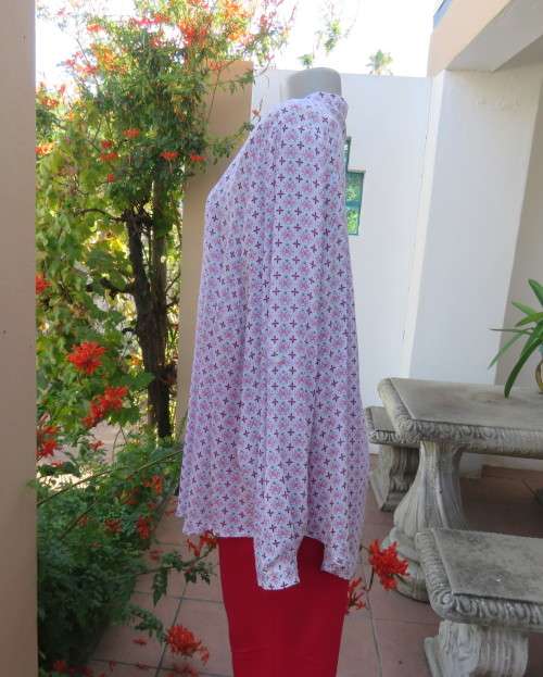 Soft 100% viscose long top in white with tiny red/pink flowers. Banded neckline with V. Size 46.
